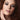 Close-up portrait of a model wearing a dark, smudged smoky eye — the pirate eye makeup look
