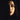 Moody, dramatically lit portrait of a woman with dark hair and deep red lips, summer goth beauty inspiration