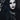 Gothic model with dramatic black lipstick and dark makeup against a black and white patterned background