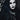 Dramatic dark goth makeup look with pale skin, deep smoky eyeliner and dark lipstick