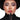 Model with sculpted contour, glossy vampy lip and bold black winged eyeliner in a black hat and gloves, goth baddie makeup inspiration